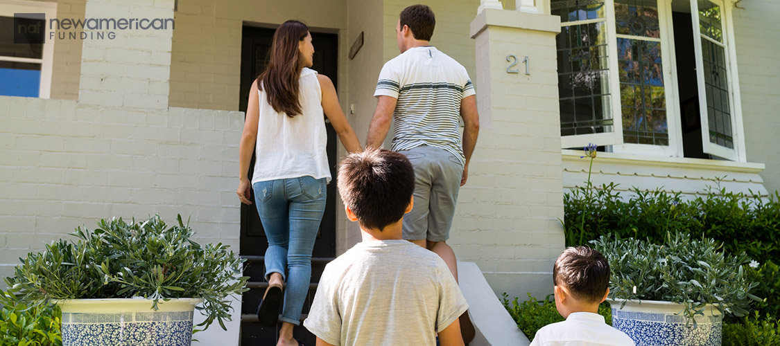 family walking into home