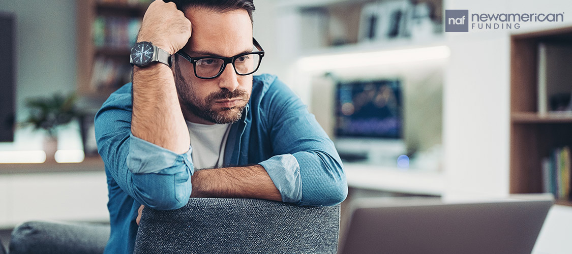 frustrated man in front of a computer