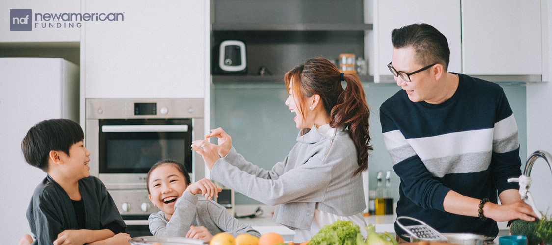 family laughing in the kitchen