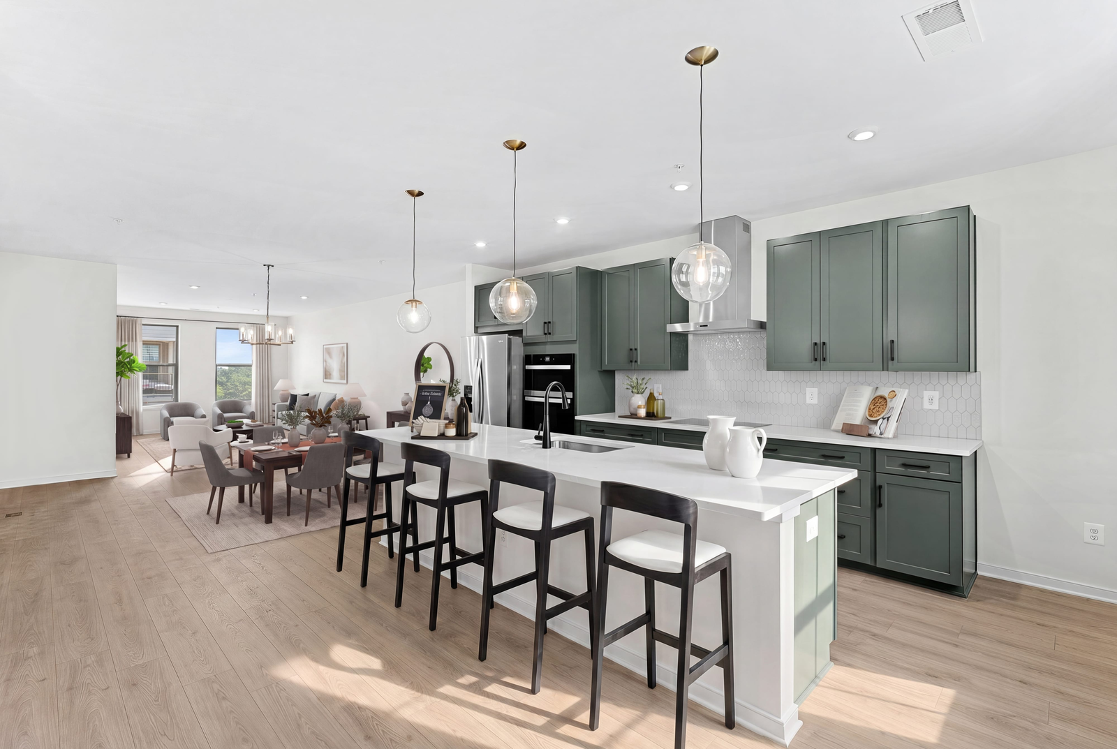 kitchen island with Chairs and pendant lighting