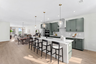 kitchen island with Chairs and pendant lighting