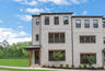 front of 3-story townhome with light brick and wood accents 