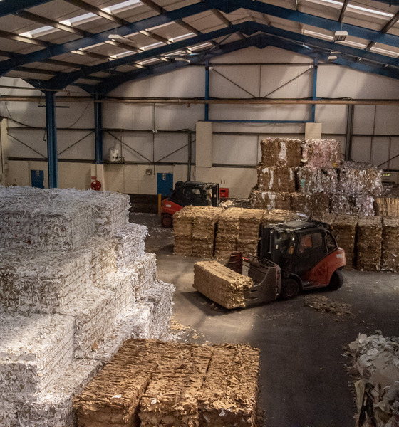 A WAREHOUSE WITH RECYCLED PAPER BALES