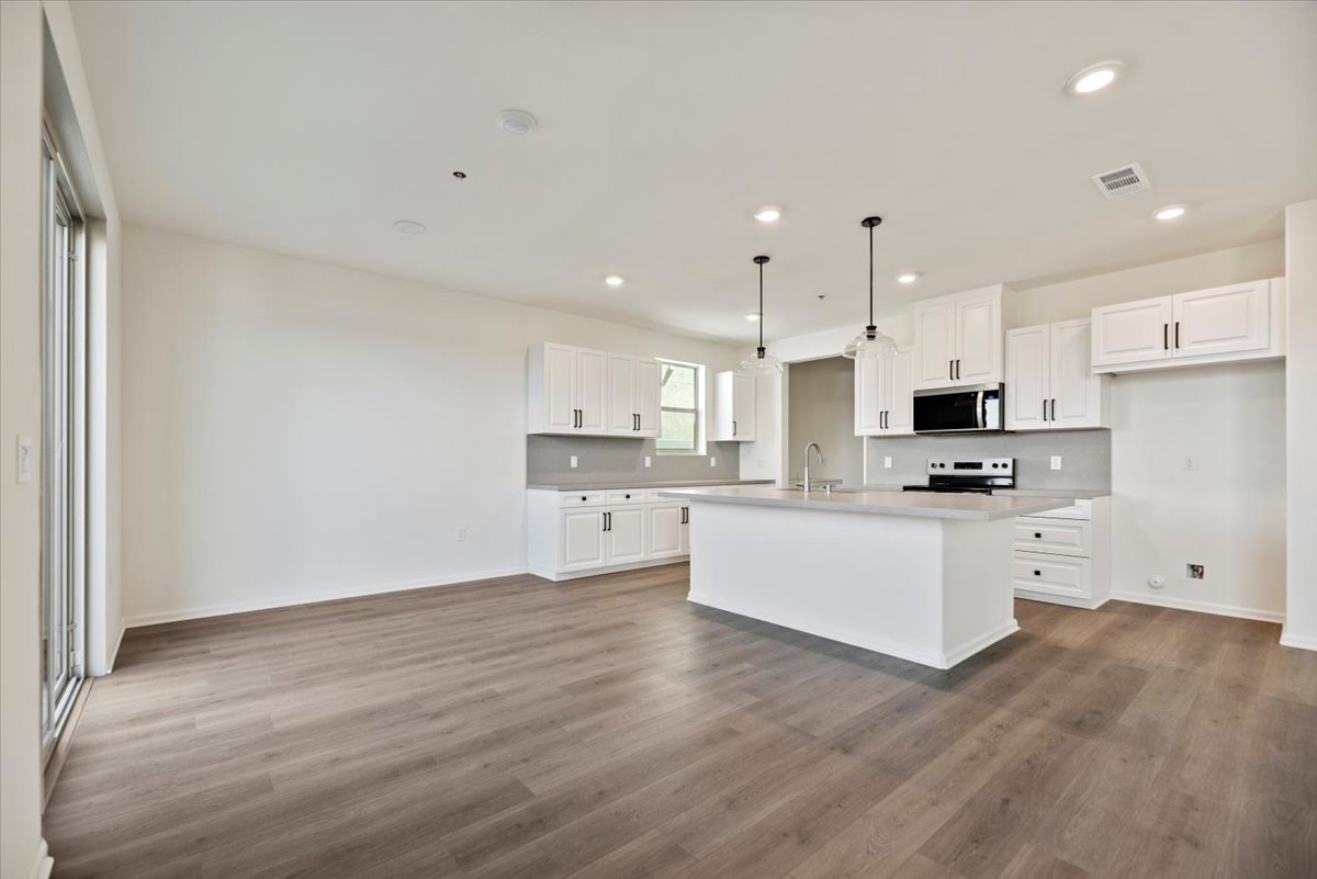 dining room with the kitchen in the background with a large island