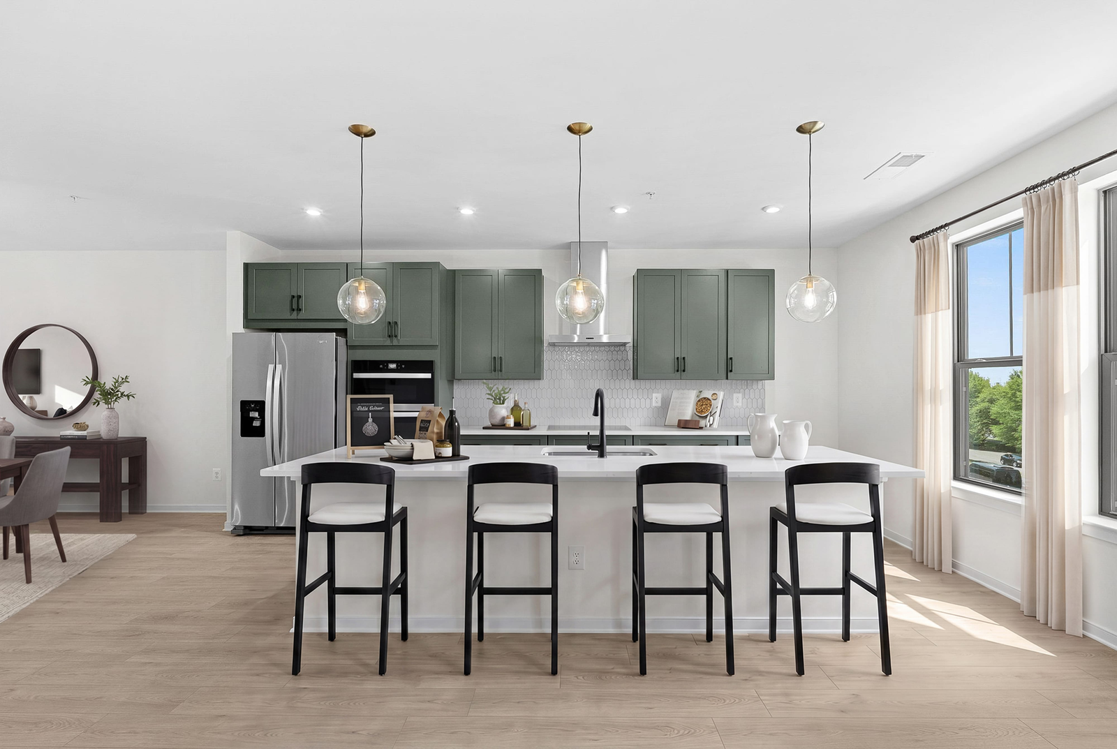 kitchen island with chairs and pendant lighting
