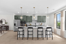 kitchen island with chairs and pendant lighting
