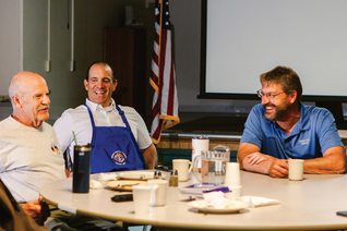 Knights talking at a table