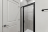walk in shower and tiles and cabinets