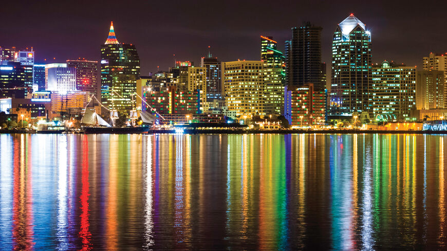 Colorful lights from the San Diego skyline reflect off the water during a New Year celebration in California.