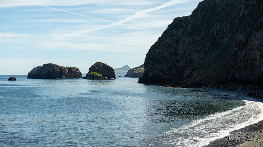 A scenic view of the rocky cliffs and sea stacks at Santa Cruz Island in Channel Islands National Park, California.