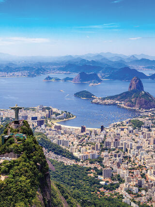 Aerial view of the Christ the Redeemer statue overlooking the city of Rio de Janeiro and Guanabara Bay in Brazil.
