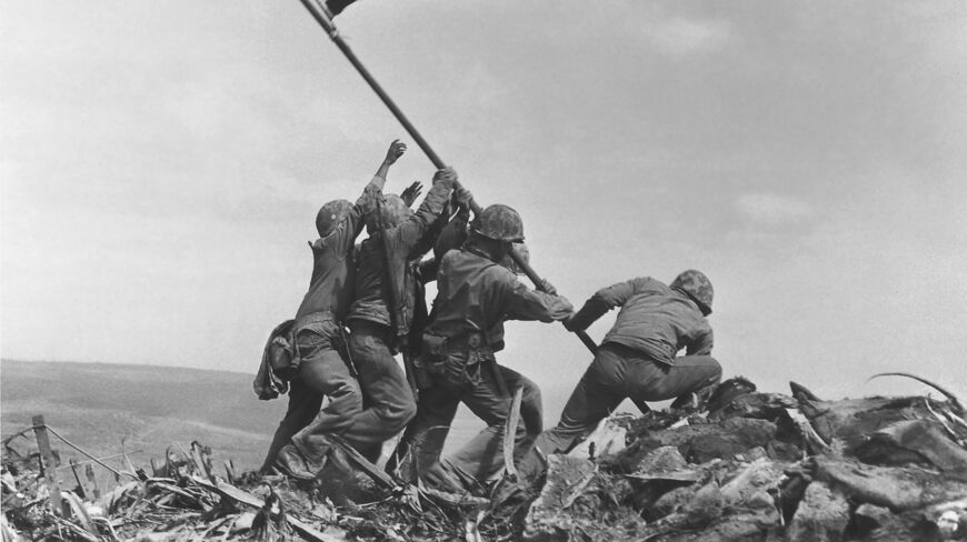 Six U.S. Marines raising the American flag on Mount Suribachi during the Battle of Iwo Jima in Joe Rosenthal’s iconic photograph.