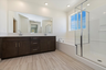bathroom with standalone tub and glass walk-in shower