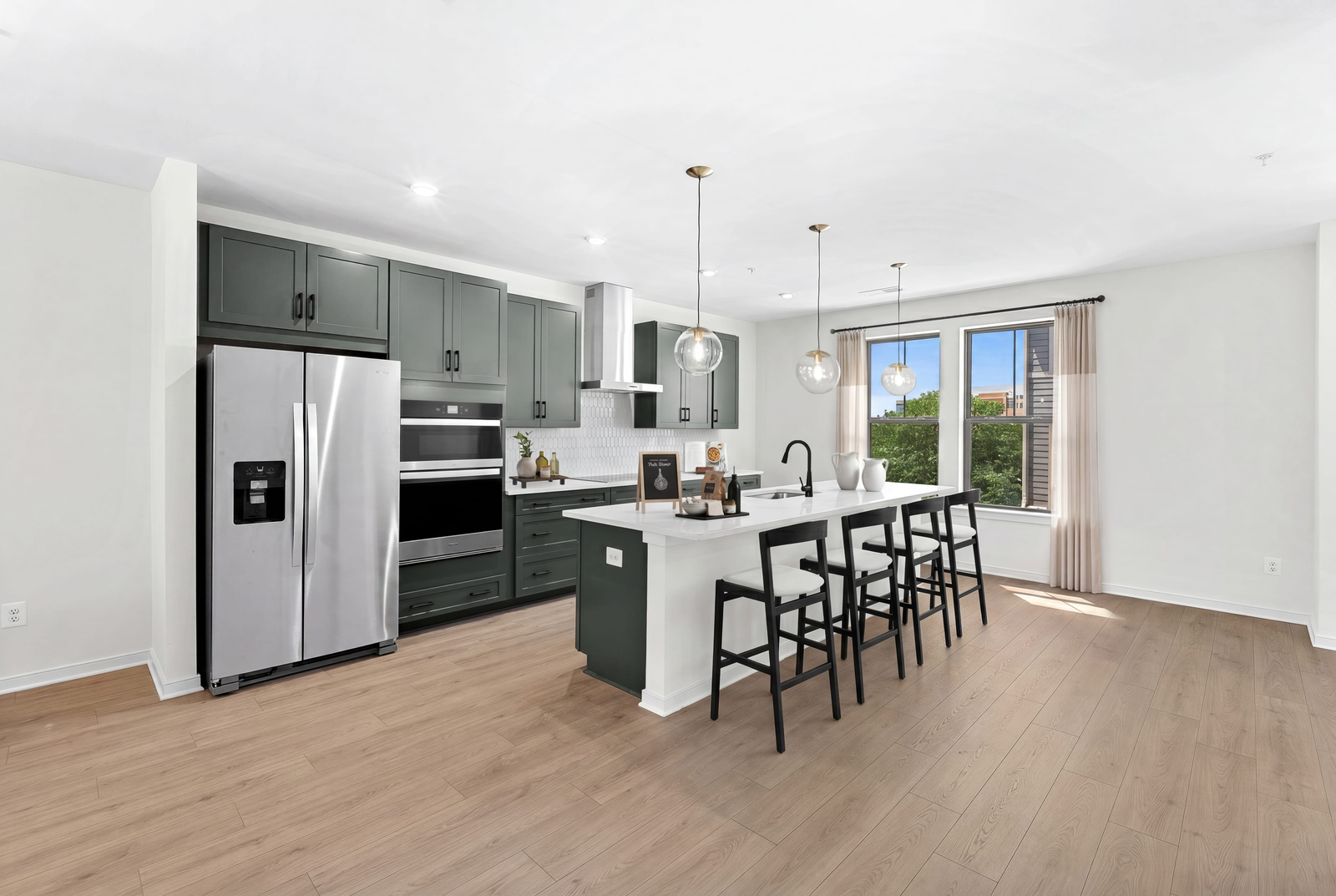 kitchen island with green countertops and stainless steel