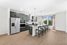 kitchen island with green countertops and stainless steel