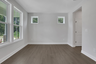 dining room with hard surface flooring and windows