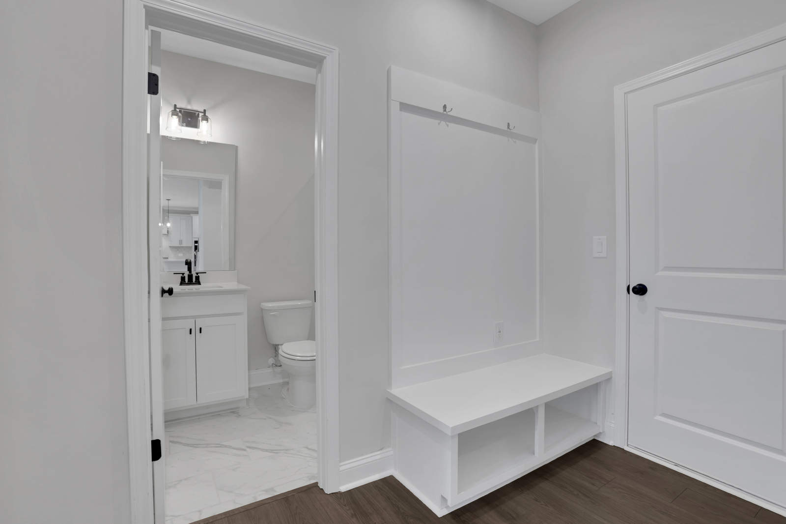 mud room with hard surface flooring and valet