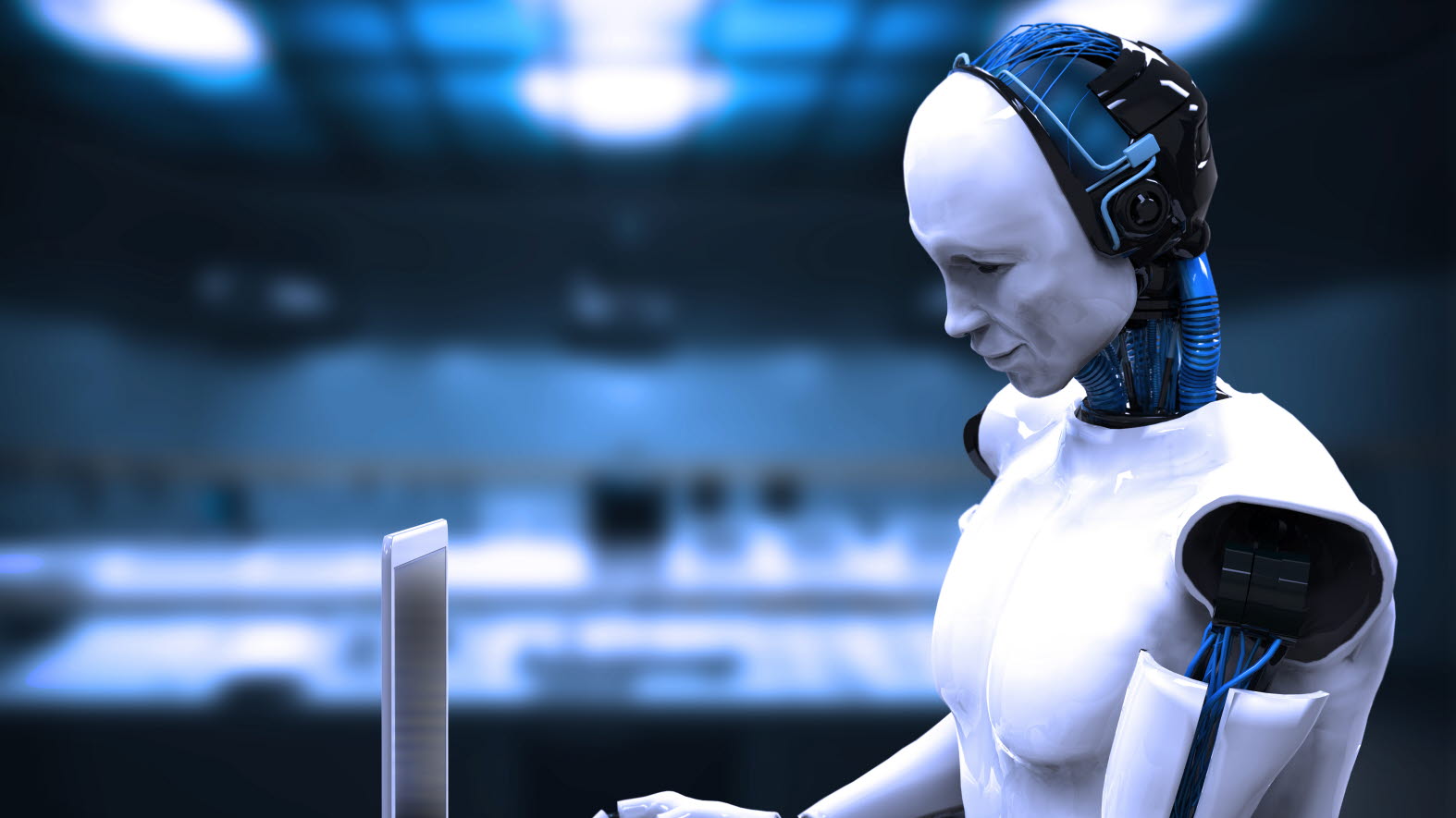 A humanoid robot working on a laptop