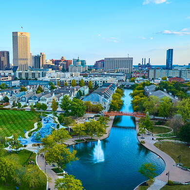Aerial view of urban park with city skyline