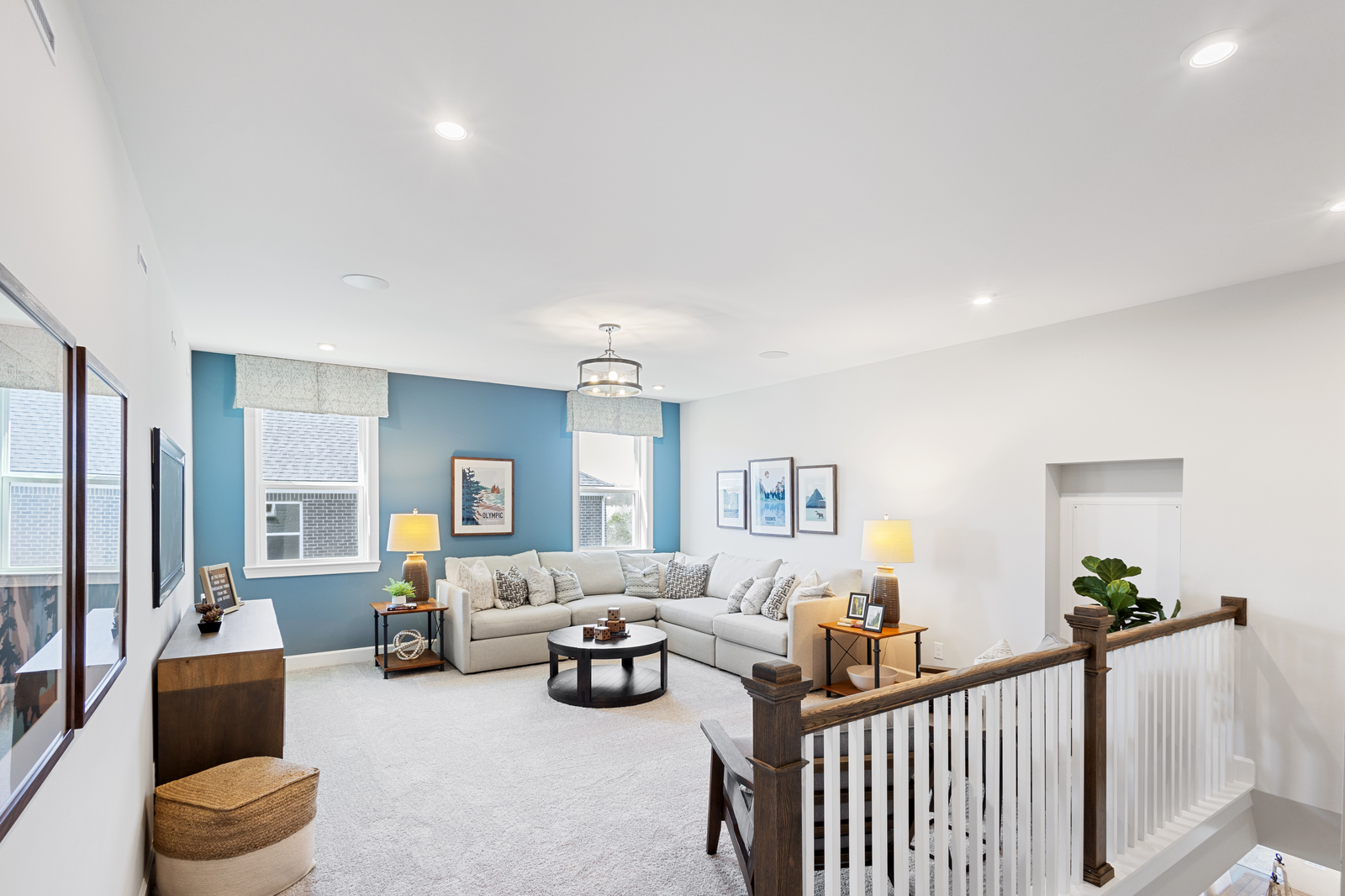 loft with blue accent wall and carpet
