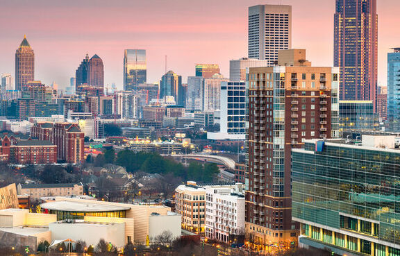 Atlanta Georgia skyline against a cloudy sunset