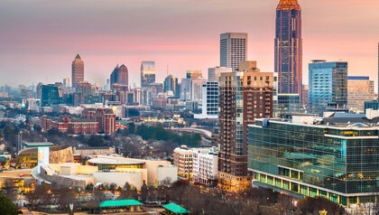 Atlanta Georgia skyline against a cloudy sunset