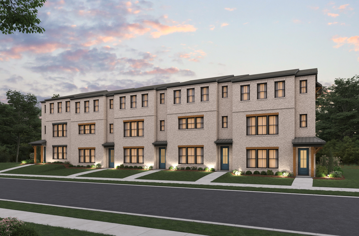 front of rear-load townhome building with brick