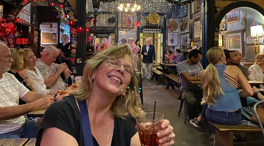 The group listens to jazz in a bar