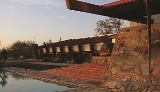 A view of Frank Lloyd Wright's Taliesin West house at sunset