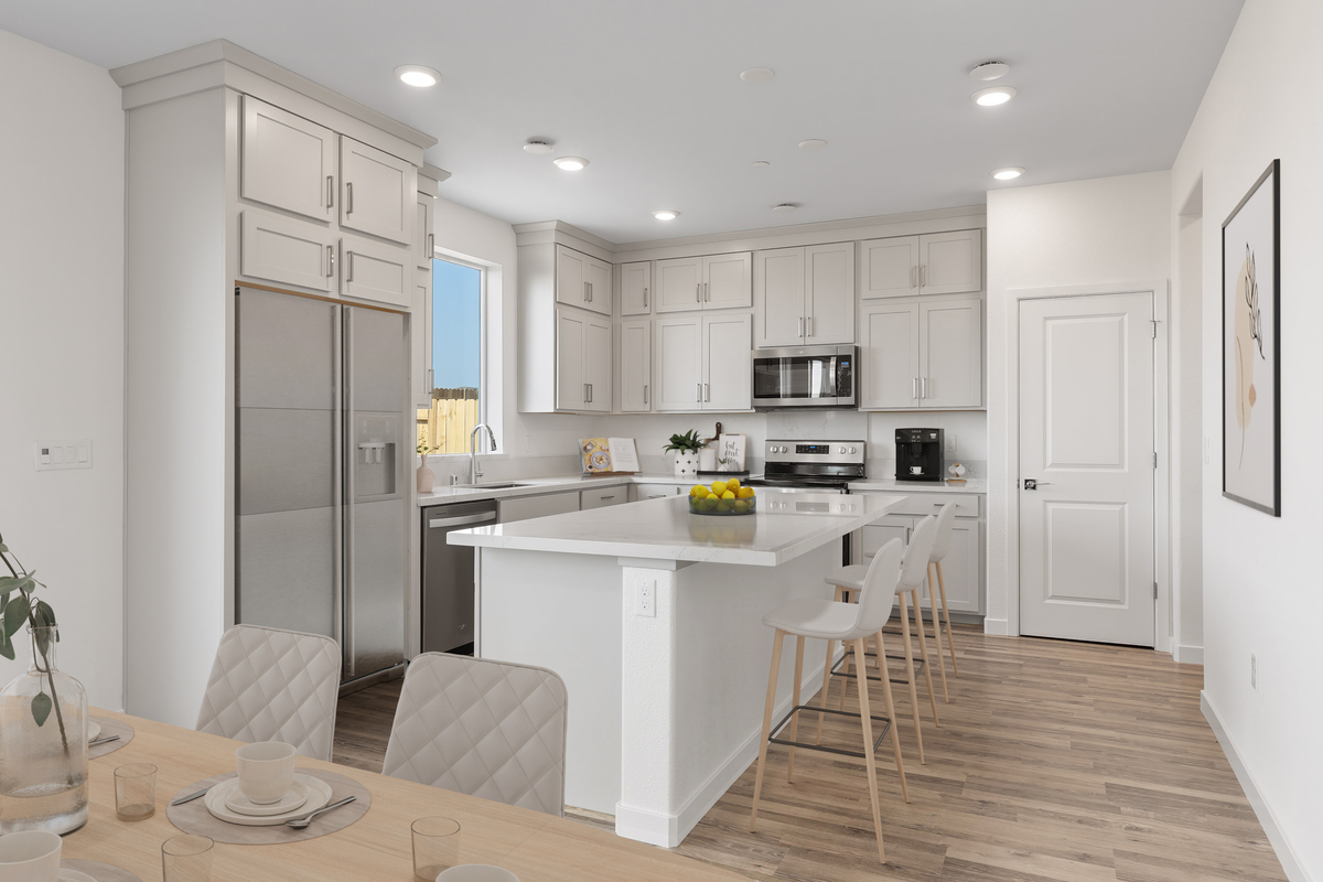 kitchen with wood floors and white cabinets