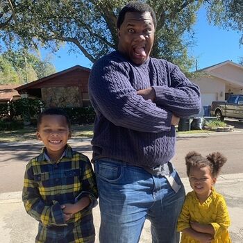 Father and children taking a funny photo