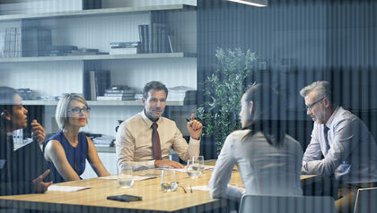 Professional team analyzing financial documents