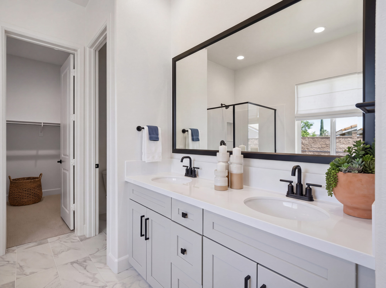primary bathroom with neutral floors and white countertops
