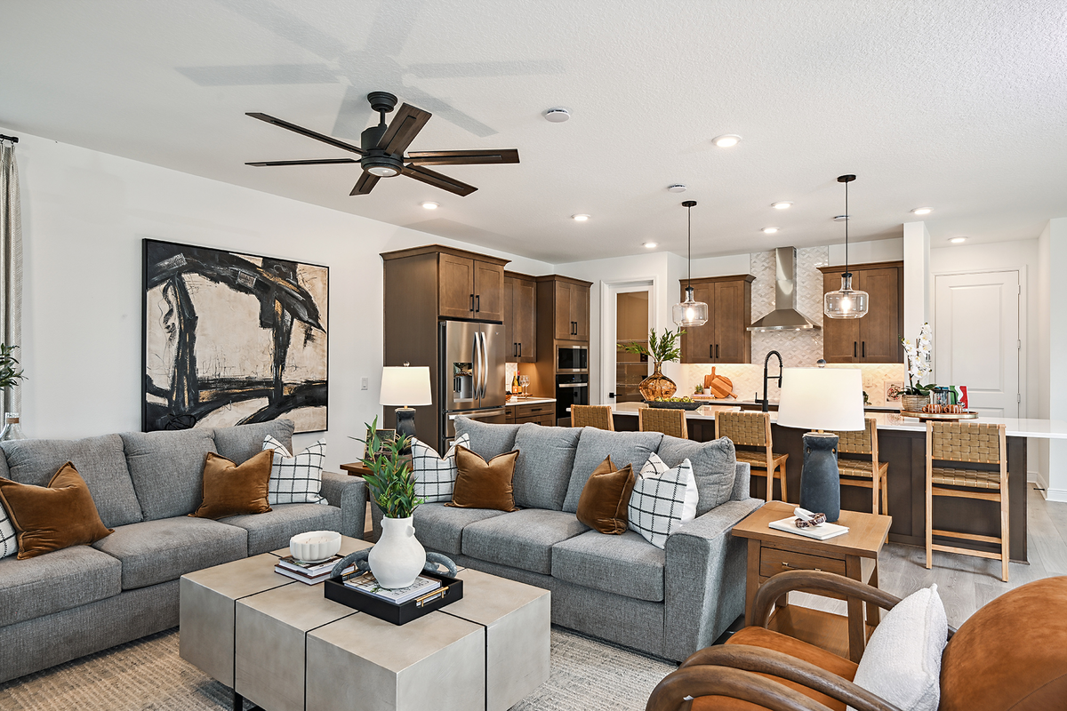 great room with two gray couches and area rug