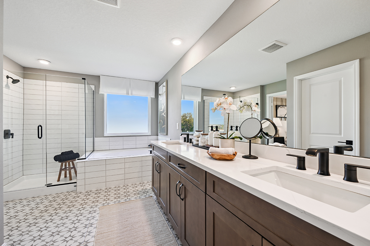 primary bathroom with separate shower and tub