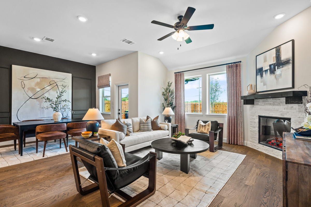 great room with a fireplace and hardwood floors