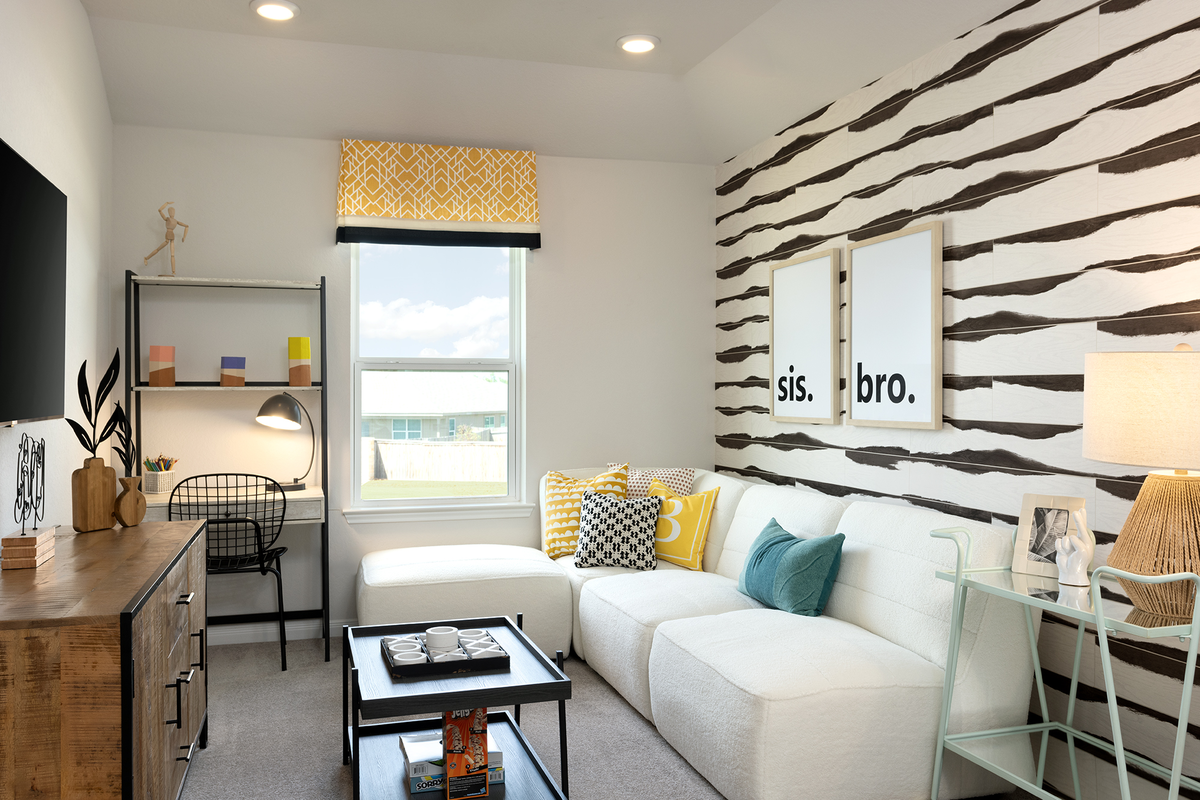 loft with accent wall, carpet & white couch