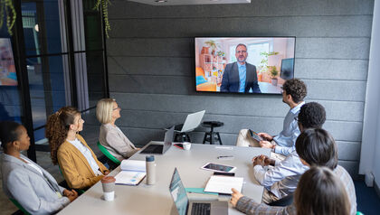 Colleagues communicate with the ceo by video conference