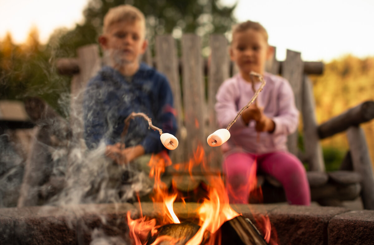kids roasting marshmallows by a fire pit