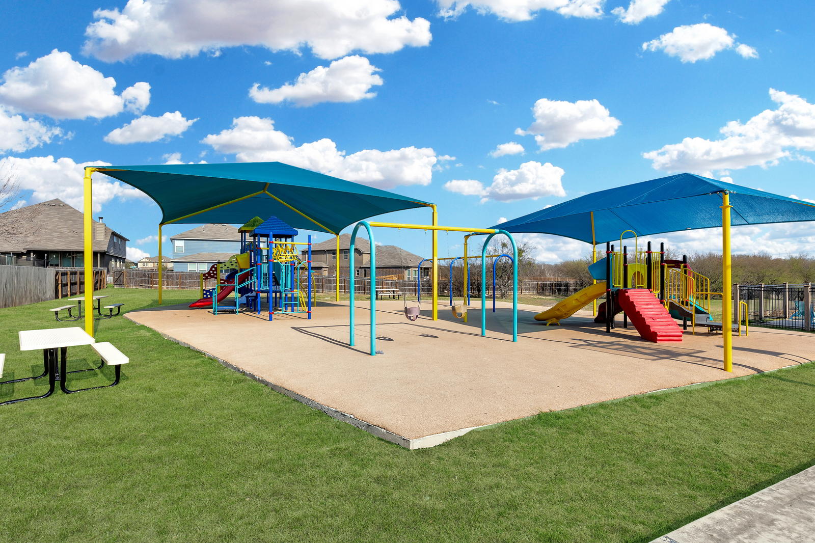 kids playground with benches & a playscape