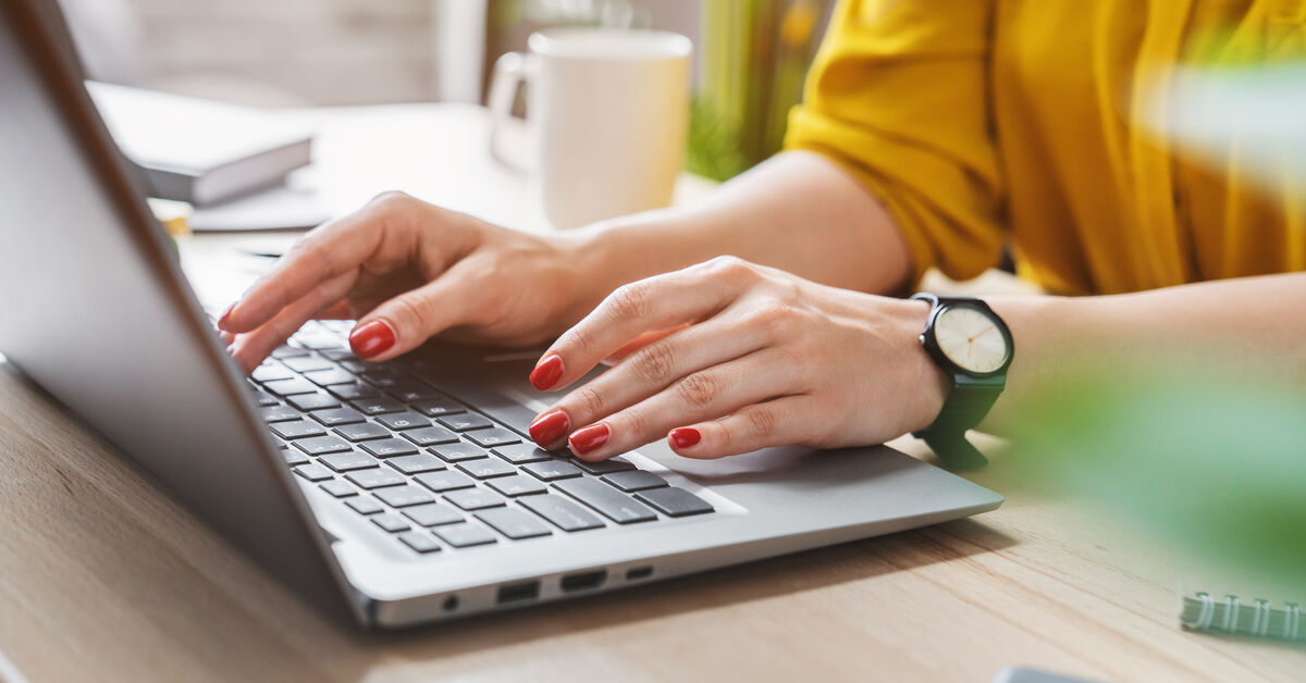 Woman typing on computer