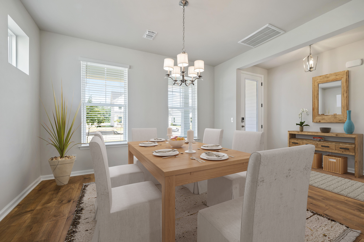 table with chairs in formal dining space