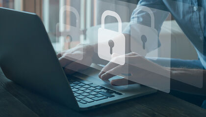 Laptop on a desktop with the icon of a padlock on the screen