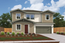 front exterior of two-story tan and white home with red front door