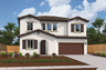 front exterior of two-story white and brown spanish style home