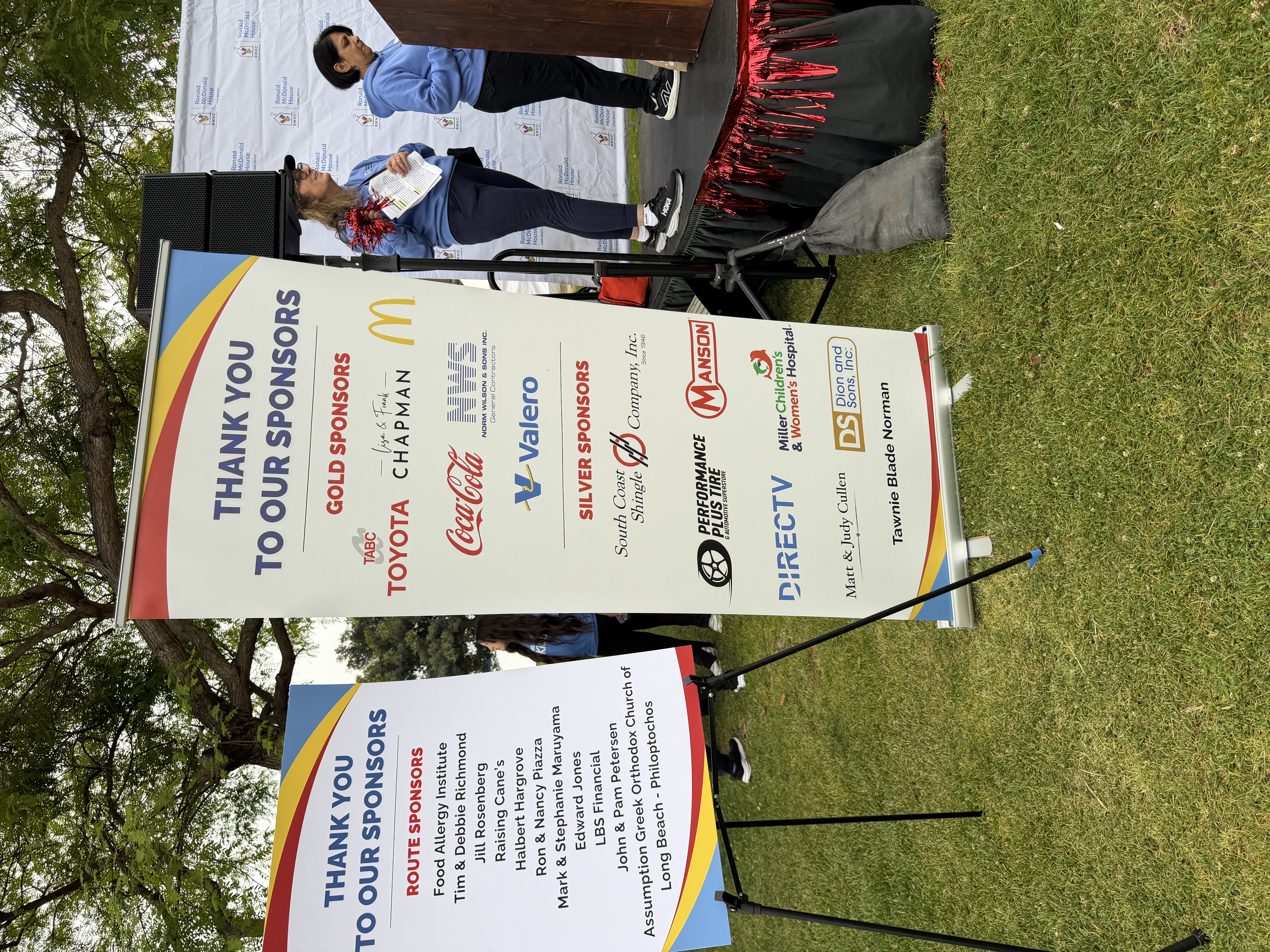 DIRECTV on sponsor sign at RMHC LB WFK.jpg