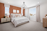 primary bedroom with large windows and neutral carpet