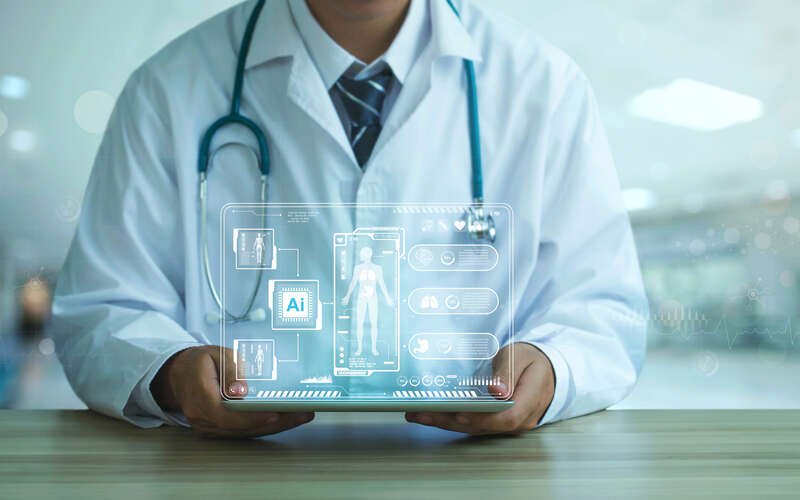 doctor holding tablet with graphics coming up showing medical and AI graphics