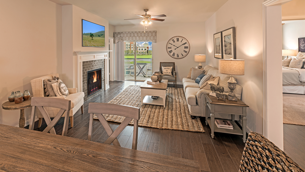 living room with wood flooring and brick fireplace
