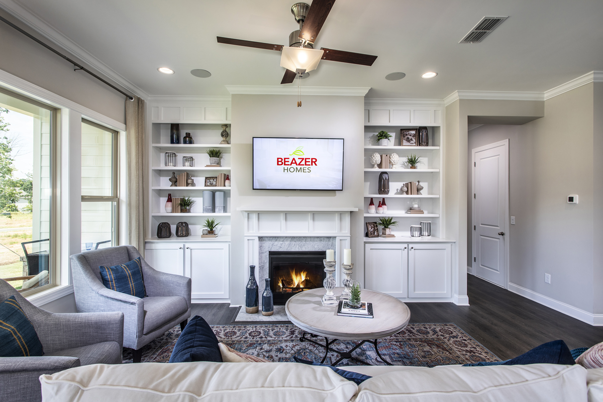great room with electric fireplace and couch